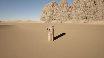 A stone pillar in the middle of a desert video