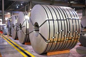 rolls of steel sheet stored in warehouse Cold rolled steel coils photo