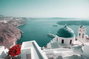 Santorini skyline with blue dome church and buildings in Greece with copy space photo