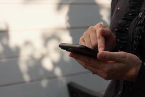 Using smartphone, phone in hand photo