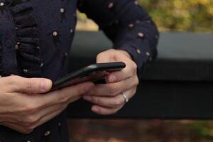 Using smartphone, phone in hand photo