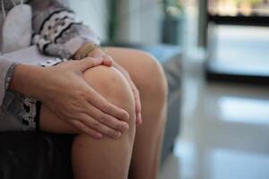 Knee massage relieves pain photo