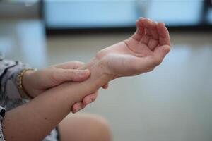 Wrist massage relieves pain. photo