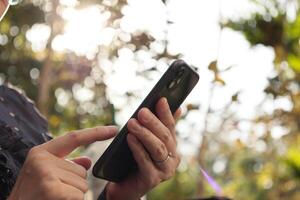 Using smartphone, phone in hand photo