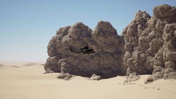 A helicopter is flying over a desert landscape video