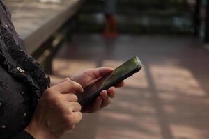 Using smartphone, phone in hand photo