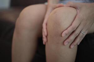 Knee massage relieves pain photo