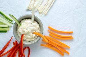 Healthy vegetables and dip snack. Vegetable sticks and dips in bowl. photo