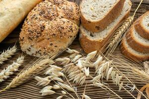 Assortment of baked goods on old wooden table. Freshly of bakery products. photo