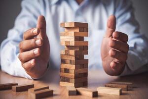 Business risks in the business. Requires planning Meditation must be careful in deciding to reduce the risk in the business. As the game drew to a wooden block from the tower photo