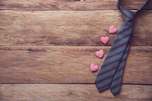 Father's Day Gift Ideas - Neckties and gift boxes are placed on wooden floor. photo