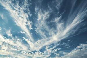 Photo of some white whispy clouds and blue sky cloudscape