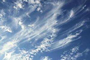 Photo of some white whispy clouds and blue sky cloudscape