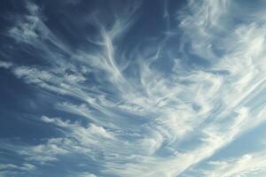 Photo of some white whispy clouds and blue sky cloudscape