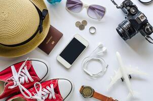 Tourism planning and costume for the trip on white background photo