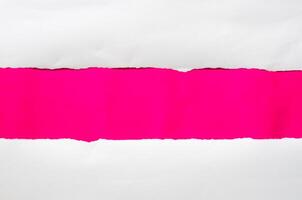 The paper is torn on a pink background and there is a cutoff to the free space for your text. photo