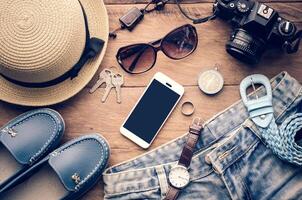 Travel accessories costumes. smart phone, luggage, The cost of travel prepared for the trip photo