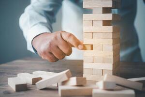 Business risks in the business. Requires planning Meditation must be careful in deciding to reduce the risk in the business. As the game drew to a wooden block from the tower photo