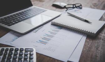Data Analysis Chart And Graphs placed on the desk in the office. Business Analysis and Planning Concept photo