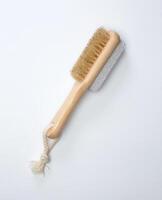 Hair brushes and Pumice foot stone isolated on white background photo