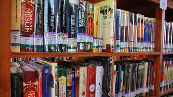 Atmosphere of people reading books in library photo