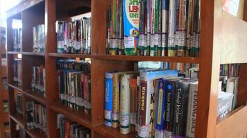 Atmosphere of people reading books in library photo