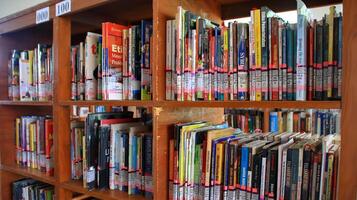 Atmosphere of people reading books in library photo