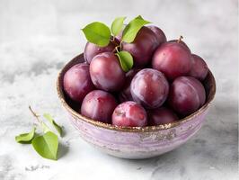 AI generated Ripe plums in a bowl on a light background. Selective focus. photo