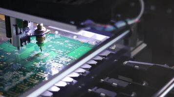 Electronic circuit board close up. Media. Process of creating an electronic chip. Automatic operation of the robot to create an electronic chip video