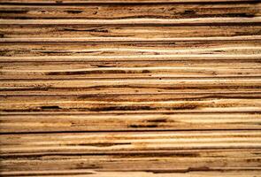 background of pattern wood section. Grid of wood squares. the raw of material timber on stack. photo