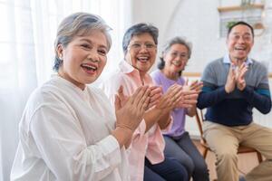 close up faces senior people sitting on bench. older people are listening and enjoy meeting focus group at living room. Joyful carefree retired senior friends enjoying relaxation at nearly home. photo