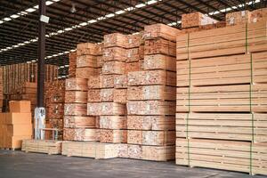 background of pattern wood section. Grid of wood squares. the raw of material timber on stack. photo