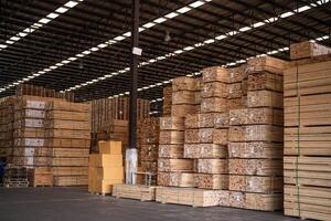 background of pattern wood section. Grid of wood squares. the raw of material timber on stack. photo