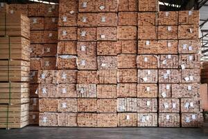 background of pattern wood section. Grid of wood squares. the raw of material timber on stack. photo