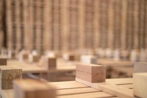 background of pattern wood section. Grid of wood squares. the raw of material timber on stack. photo