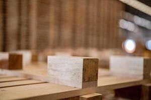 box of timber. background of pallet wood in warehouse. pattern wood section. Grid of wood squares. the raw of material timber on stack. photo