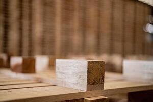 box of timber. background of pallet wood in warehouse. pattern wood section. Grid of wood squares. the raw of material timber on stack. photo