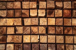 background of pattern wood section. Grid of wood squares. the raw of material timber on stack. photo