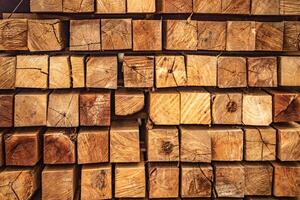 background of pattern wood section. Grid of wood squares. the raw of material timber on stack. photo