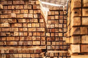 background of pattern wood section. Grid of wood squares. the raw of material timber on stack. photo