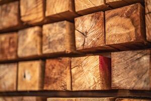 background of pattern wood section. Grid of wood squares. the raw of material timber on stack. photo