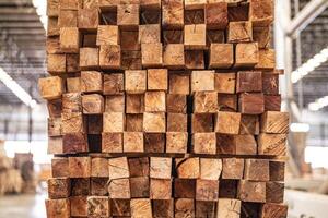 background of pattern wood section. Grid of wood squares. the raw of material timber on stack. photo