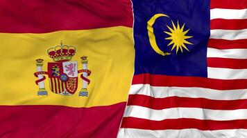 Spagna e Malaysia bandiere insieme senza soluzione di continuità looping sfondo, loop urto struttura stoffa agitando lento movimento, 3d interpretazione video