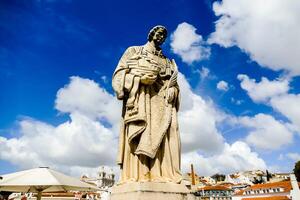 a statue of a man holding a basket photo