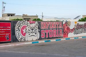 6.11.23 El Jem, Tunisia Street art  Political Graffiti on walls in City of El Jem Tunisia photo