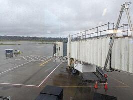 PORTLAND, USA - 12.10.2023 Interior Portland Airport. View from the window of planes and passengers boarding. photo