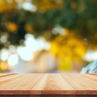 Wooden table top on nature background - can be used for montage or free display of your products photo