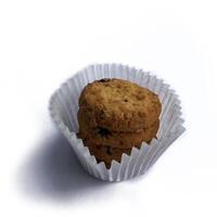 A pile of brownish-colored Cookies isolated on a white background. photo