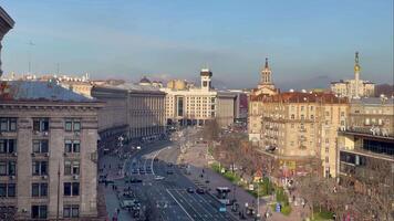 Aerial view of Khreshchatyk street in Kyiv. Maidan Nezalezhnosti in the capital of Ukraine. City life on Central Square. Pedestrians and vehicular traffic. Ukraine, Kyiv - January 2, 2024. video