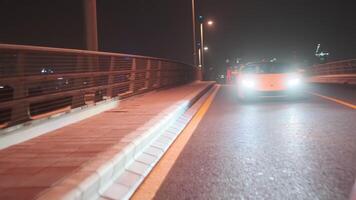 Dubai, UAE - 1 14 2023. Sports premium yellow car on a night street in Dubai video